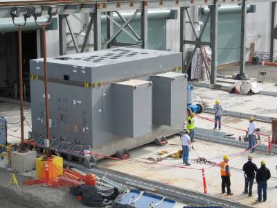 In 2012, a Low-Activity Waste Facility melter is pulled out of the building on rails for inspection. The melter will be one of two used to heat Hanford’s underground low-activity tank waste and glass-forming materials to 2,100 degrees Fahrenheit before the mixture is poured into stainless steel containers for permanent storage in a process called vitrification.